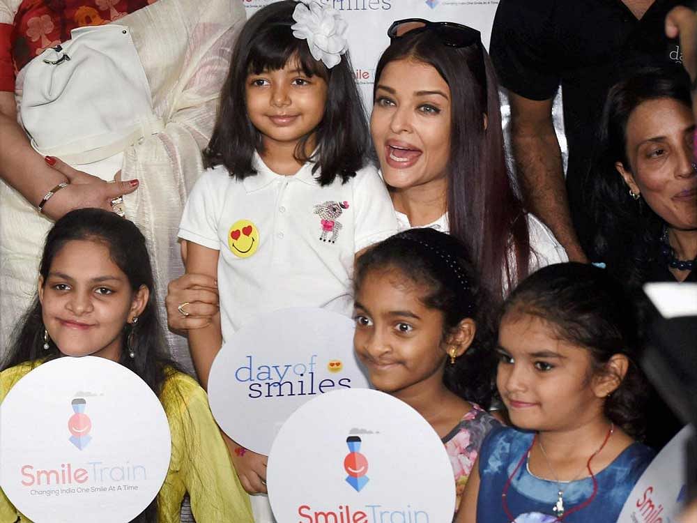 Bollywood actor Aishwarya Rai Bachchan with her daughter Aaradhya during a charity event in Mumbai. PTI Photo
