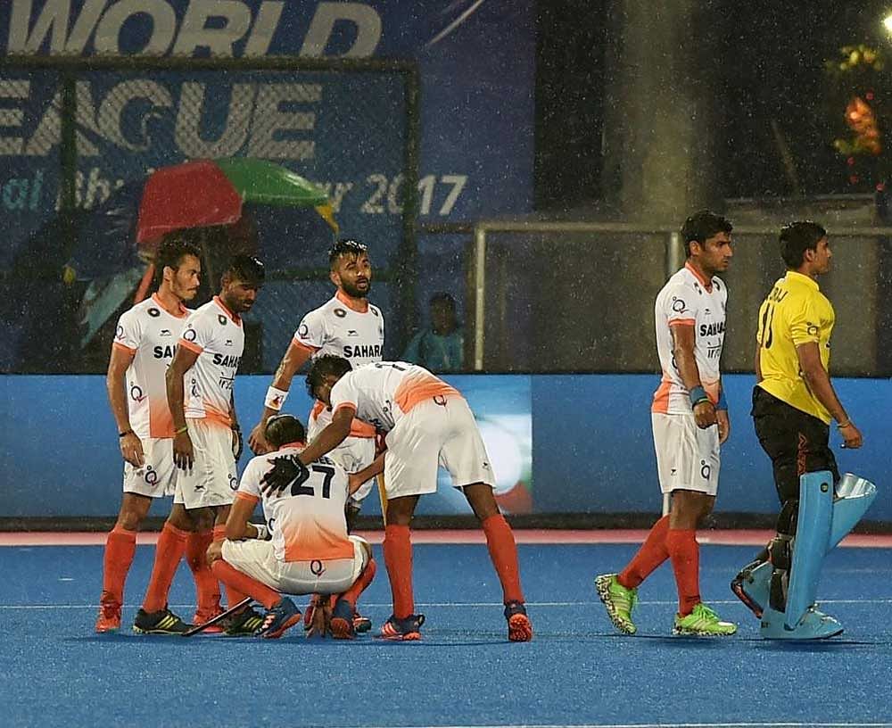 India players console their teammate Akashdeep Singh(27) after they lost 1st semifinal match against Argentina during Men's Hockey World league final at Kalinga Stadium in Bhubaneswar on Friday evening. PTI Photo