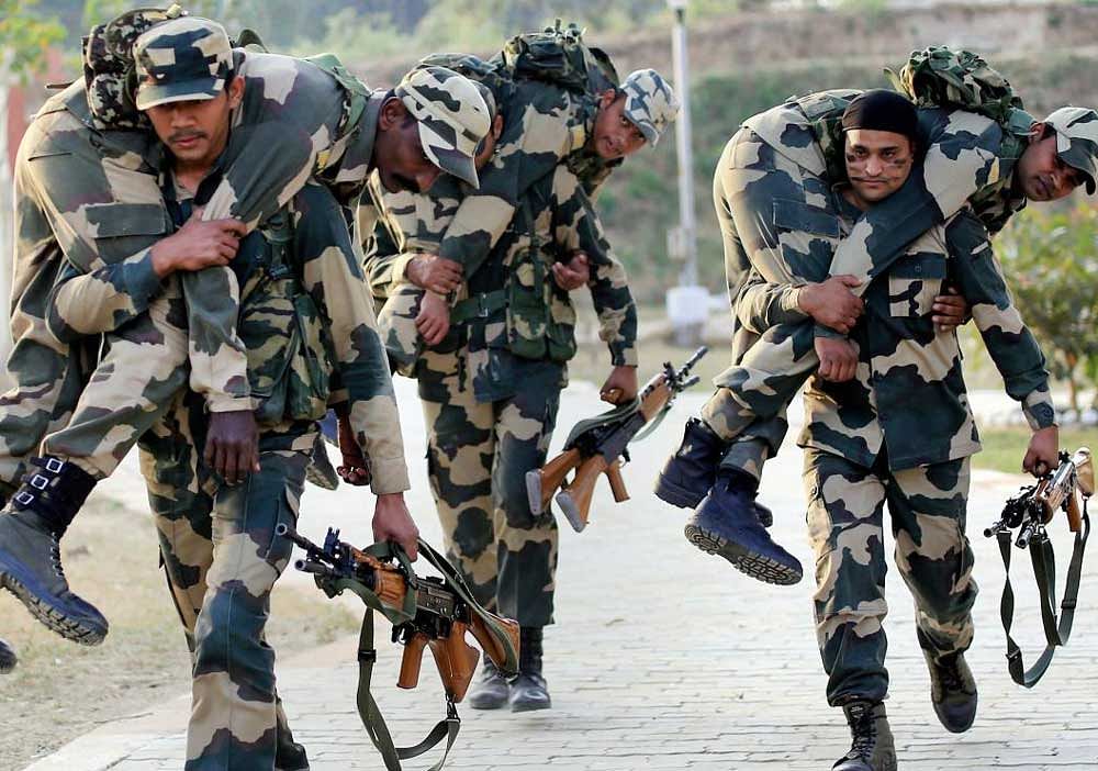 Border Security Force (BSF) jawans during a training session at Kathua, about 90 kms from Jammu on Saturday. PTI Photo