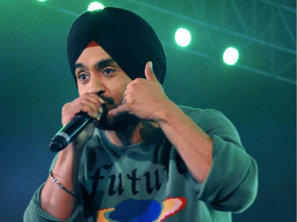 Bollywood actor and singer Diljit Dosanjh performs at an event in Gurugram on Saturday night. PTI Photo