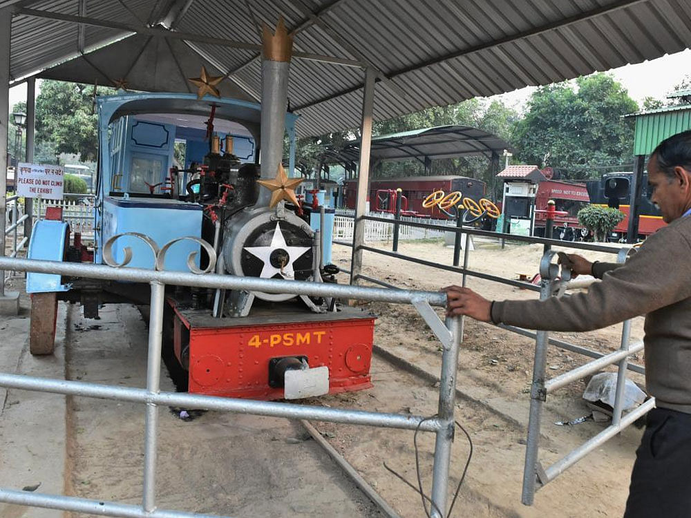A worker opens enclosure of 108 yrs old monorail which was used by Maharaja of Patiala, Lt. Bhupinder Singh, at National Rail Museum (NRM), Chanakayapuri, in New Delhi on Wednesday. National Rail Museum took initiative to start this train on every Th...