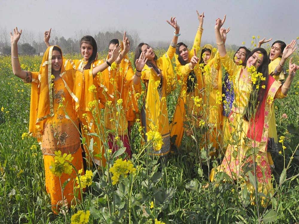  School students wear the customary yellow dress for Basant Panchami celebrations, in Moradabad on Monday. PTI Photo