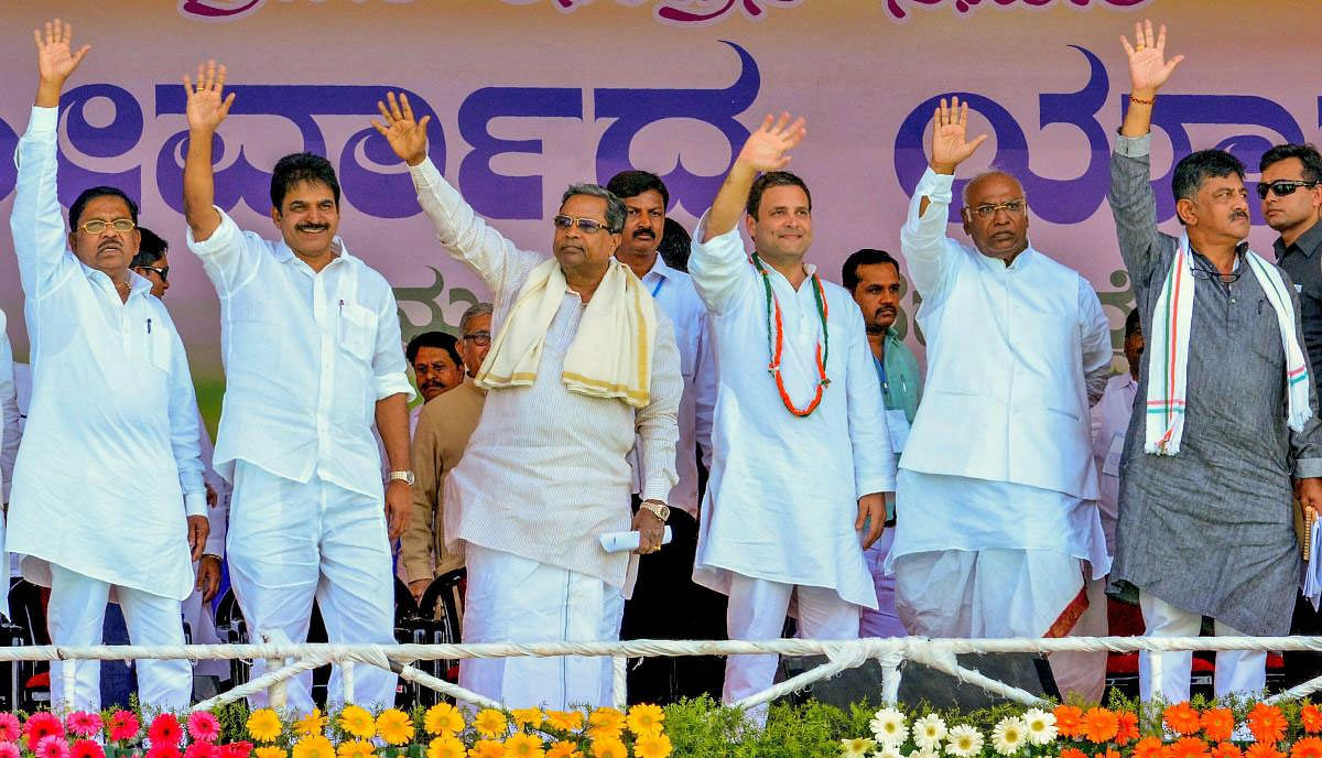 Congress President Rahul Gandhi, Karnataka Chief Minister M Siddaramaiah, Senior leader Mallikarjun Kharge, KC Venugopal, G Parameshwara and DK Shivakumar wave during the second leg of Janashirvad Yatra ahead of Karnataka Assembly elections at Athani...