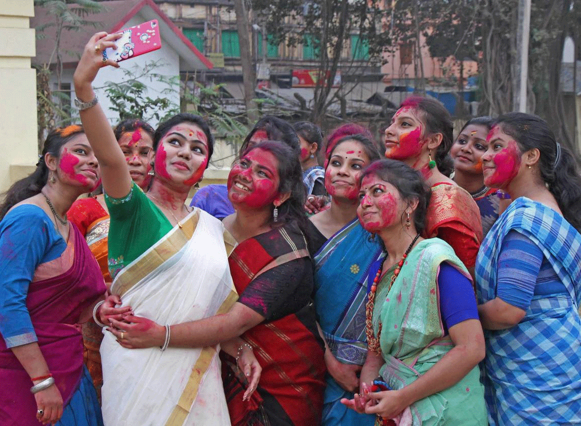  Students take a selfie during Holi celebration in Visva-Bharati University Campus at Sriniketan in Birbhum district of West Bengal on Sunday. PTI Photo