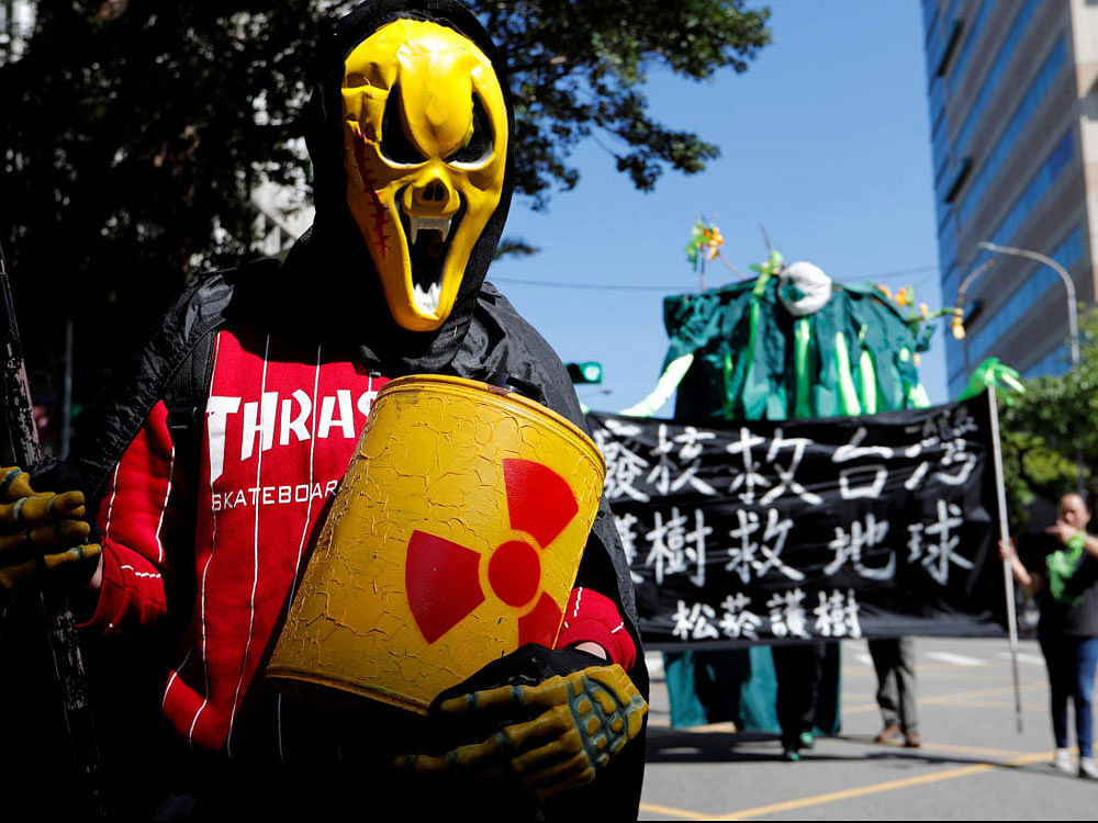 Demonstrators take part in a protest against nuclear power on the 7th anniversary of Japan's Fukushima nuclear disaster, in Taipei, Taiwan March 11, 2018.