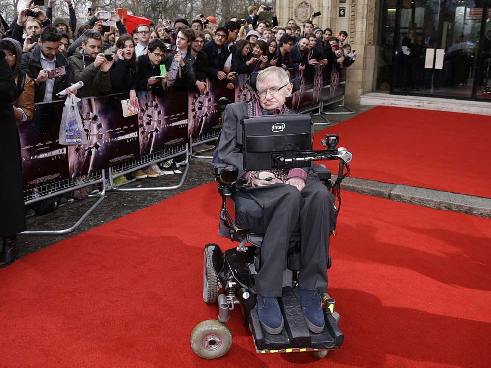 In this March 30, 2015 file photo, Professor Stephen Hawking poses for photographers upon arrival for the Interstellar Live show at the Royal Albert Hall in central London. Hawking, whose brilliant mind ranged across time and space though his body wa...