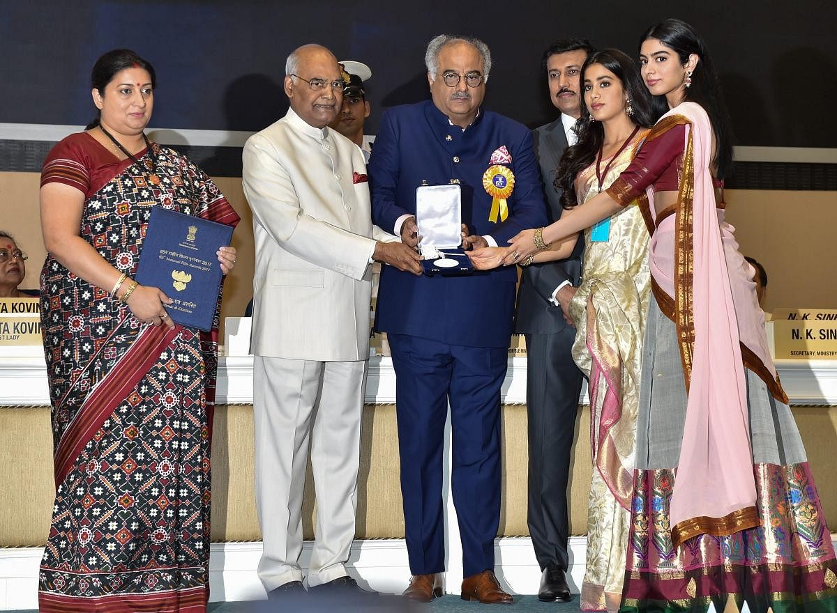 President Ram Nath Kovind confers Best Actress Award on veteran actress Sridevi (posthumously), being received by her husband Boney Kapoor and daughters Janhvi and Khushi, during the 65th National Film Awards function at Vigyan Bhavan in New Delhi on Thursday. Union I&B Minister Smriti Irani and MoS for I & B Rajyavardhan Rathore are also seen. PTI Photo