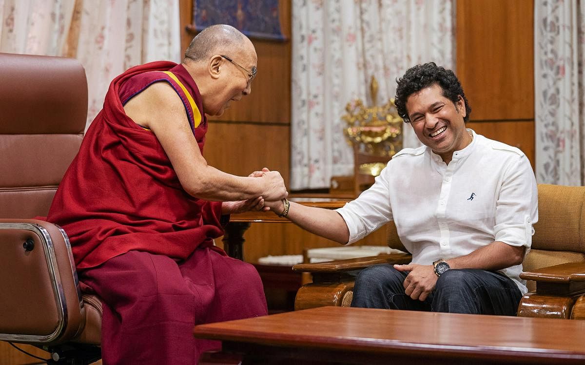 Cricket legend Sachin Tendulkar meets Tibetan spiritual lLeader, the Dalai Lama in Dharamshala on Thursday. PTI Photo