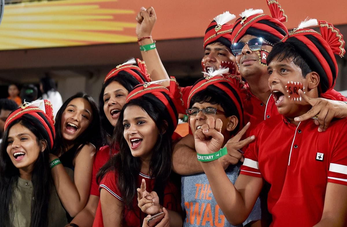 Sunrisers Hyderabad supporters cheer for their team during Indian Premier League match against Royal Challengers Bangalore in Hyderabad on Monday. PTI