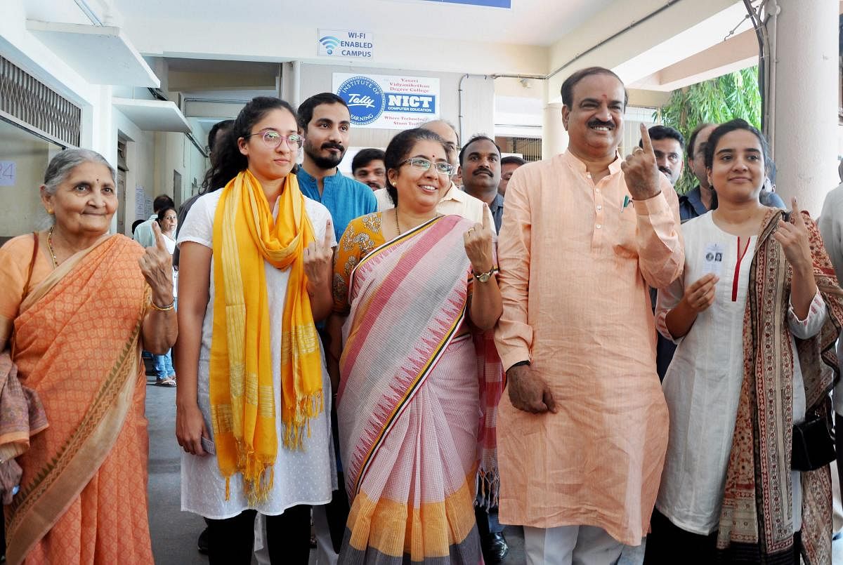  Union Minister Ananth Kumar with his family show their inked finger after casting their ballot during the polling day for the Karnataka Assembly election 2018 in Bengaluru on Saturday. PTI Photo