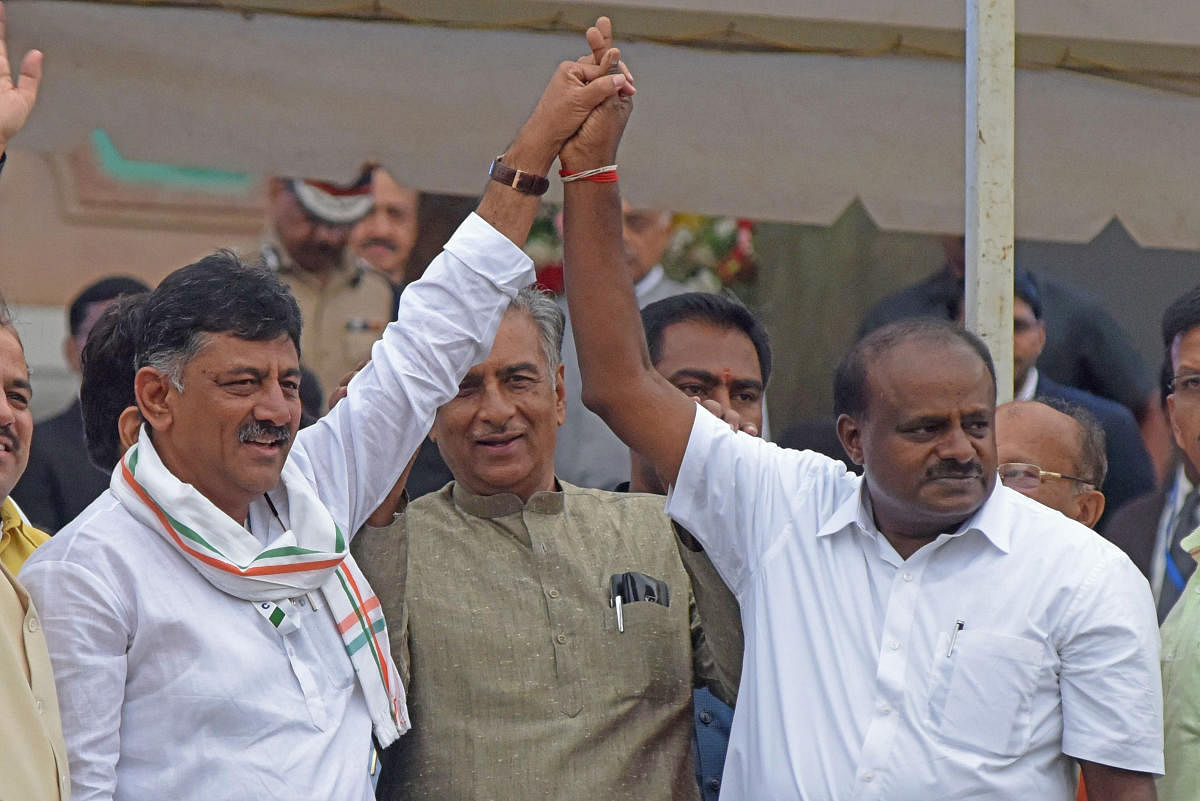 Newly sworn-in Karnataka Chief Minister H D Kumaraswamy and Congress leader D K Shivakumar seen after the swearing-in ceremony in front of Vidhana Soudha in Bengaluru. DH Photo