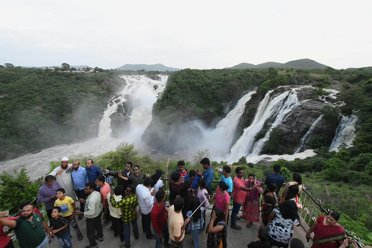 A group of tourists at Shivanasamudra Falls (Bluff) near Mysuru. PTI Photo
