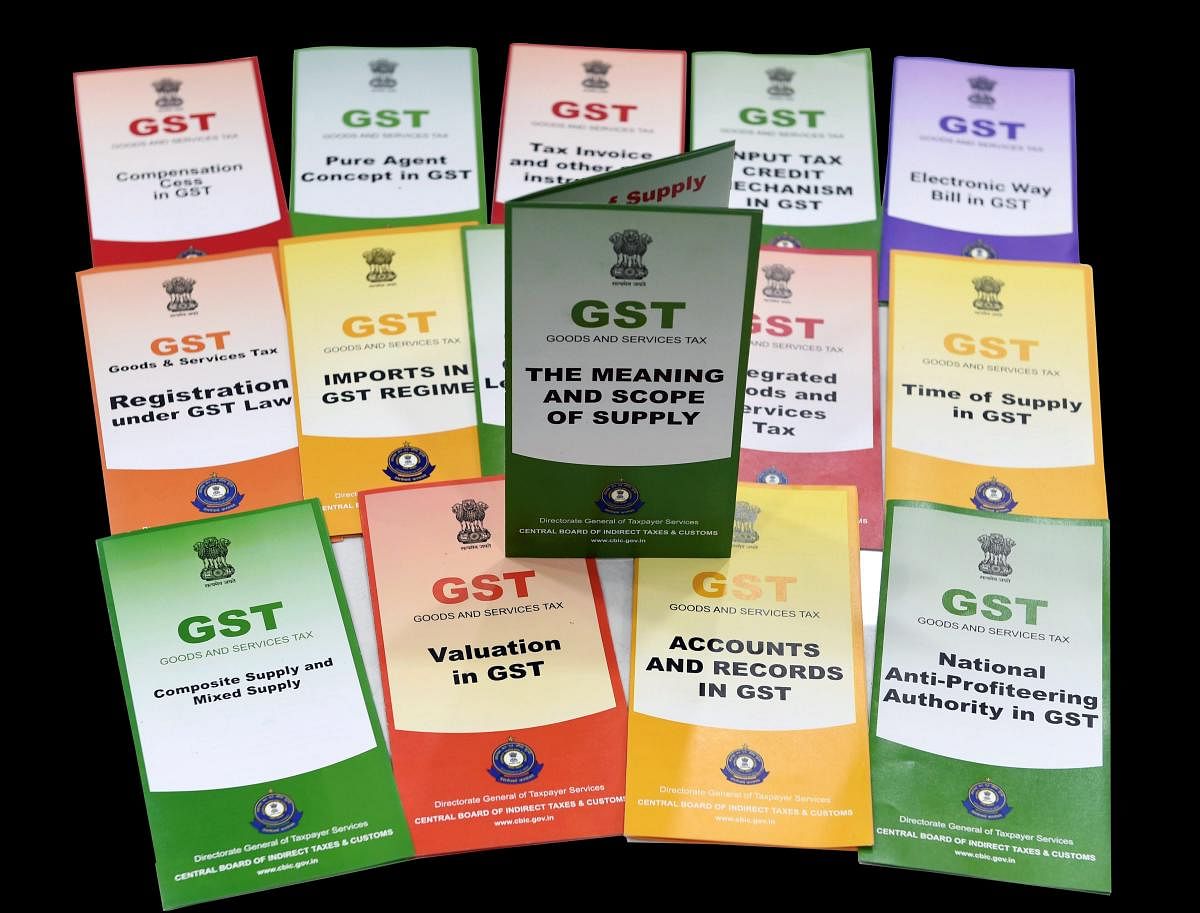 Booklets on GST (Goods and Services Tax), which were distributed by the Central Board of Direct Taxes at a function organised to celebrate GST Day, in New Delhi on Sunday, July 1, 2018. (PTI Photo)