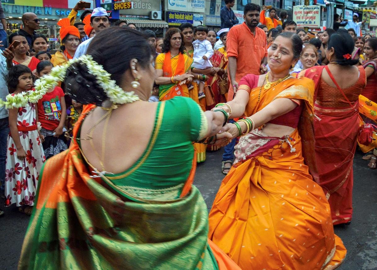 Devotees participate in a 'Dindi' procession of Lord Vitthal on the occasion of 'Ashadi Ekadashi' at a temple, in Jabalpur on Monday. (PTI Photo)