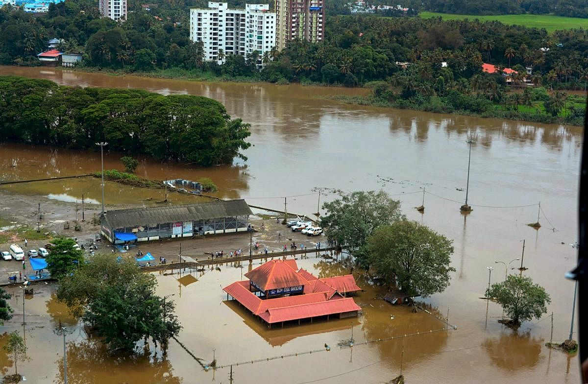 An aerial view of Aluva town following a flash flood after heavy rain, in Kochi on Sunday, August 12, 2018. (PTI Photo)