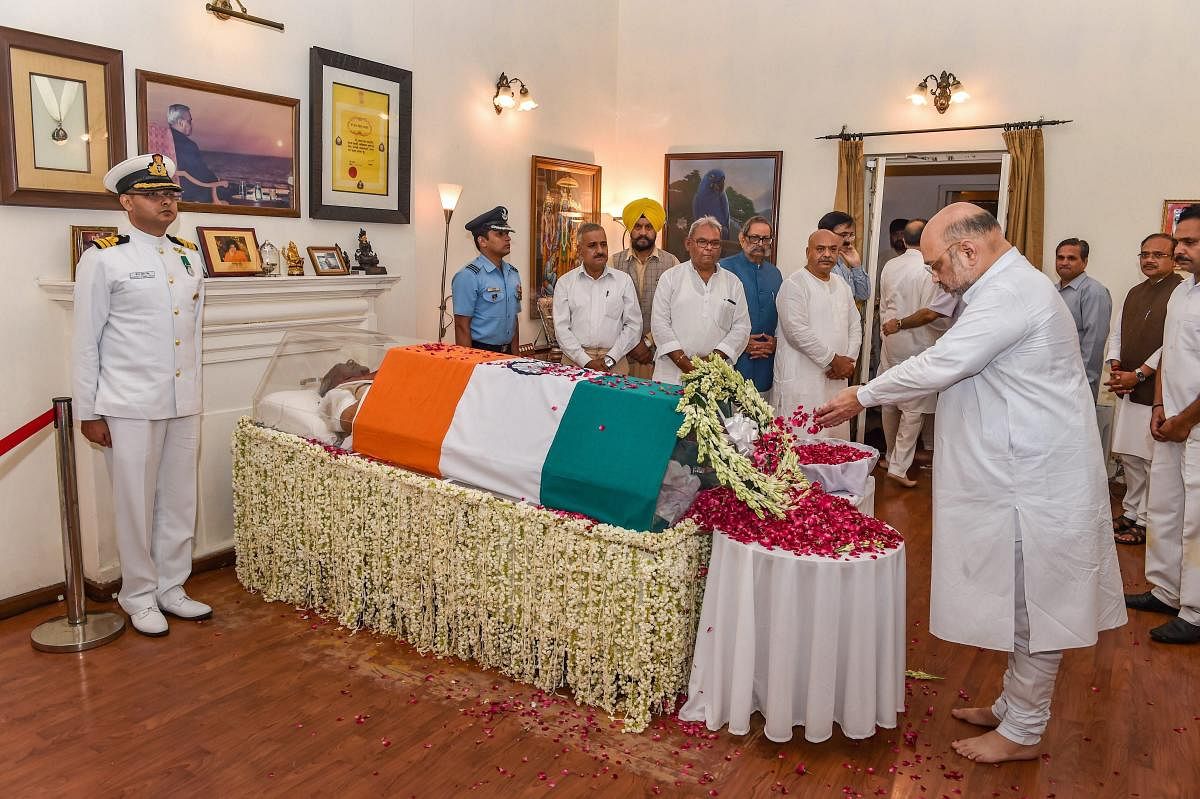 BJP President Amit Shah pays tribute to former prime minister Atal Bihari Vajpayee, at his Krishna Menon Marg residence, in New Delhi on Thursday, Aug 16, 2018. Vajpayee, 93, passed away at AIIMS hospital after a prolonged illness. (PTI Photo/Manvender Vashist)