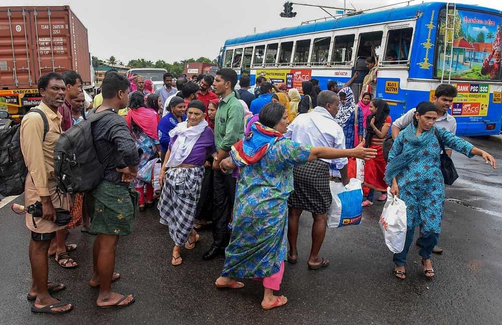 People being shifted to a relief camp after they were rescued from a various flood-hit areas, in Kochi, Kerala on Friday. PTI Photo 