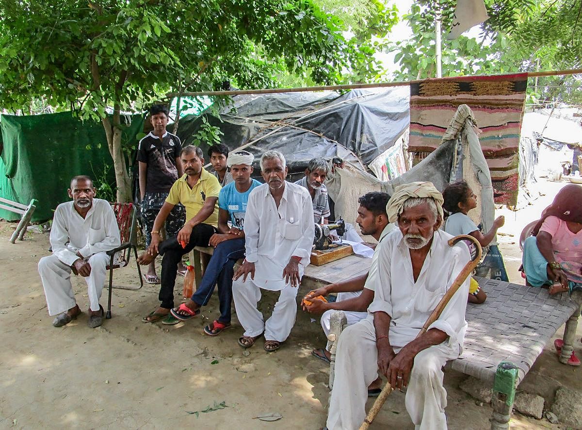 Mirchpur Dalit members sit inside a secured camp located at a farmhouse, in Hisar on Friday, Aug 24, 2018. The Delhi High Court today dismissed the appeal of 15 persons belonging to the dominant Jat community against their conviction and sentencing in a case of burning alive a 70-year-old Dalit man and his physically-challenged daughter at Mirchpur in 2010. PTI