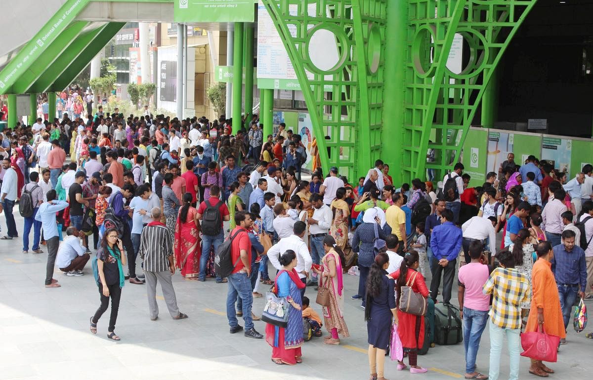 Commuters gather at Huda City Centre after Delhi Metro Services was disrupted, in Gurugram on Sunday, Aug 26, 2018. PTI