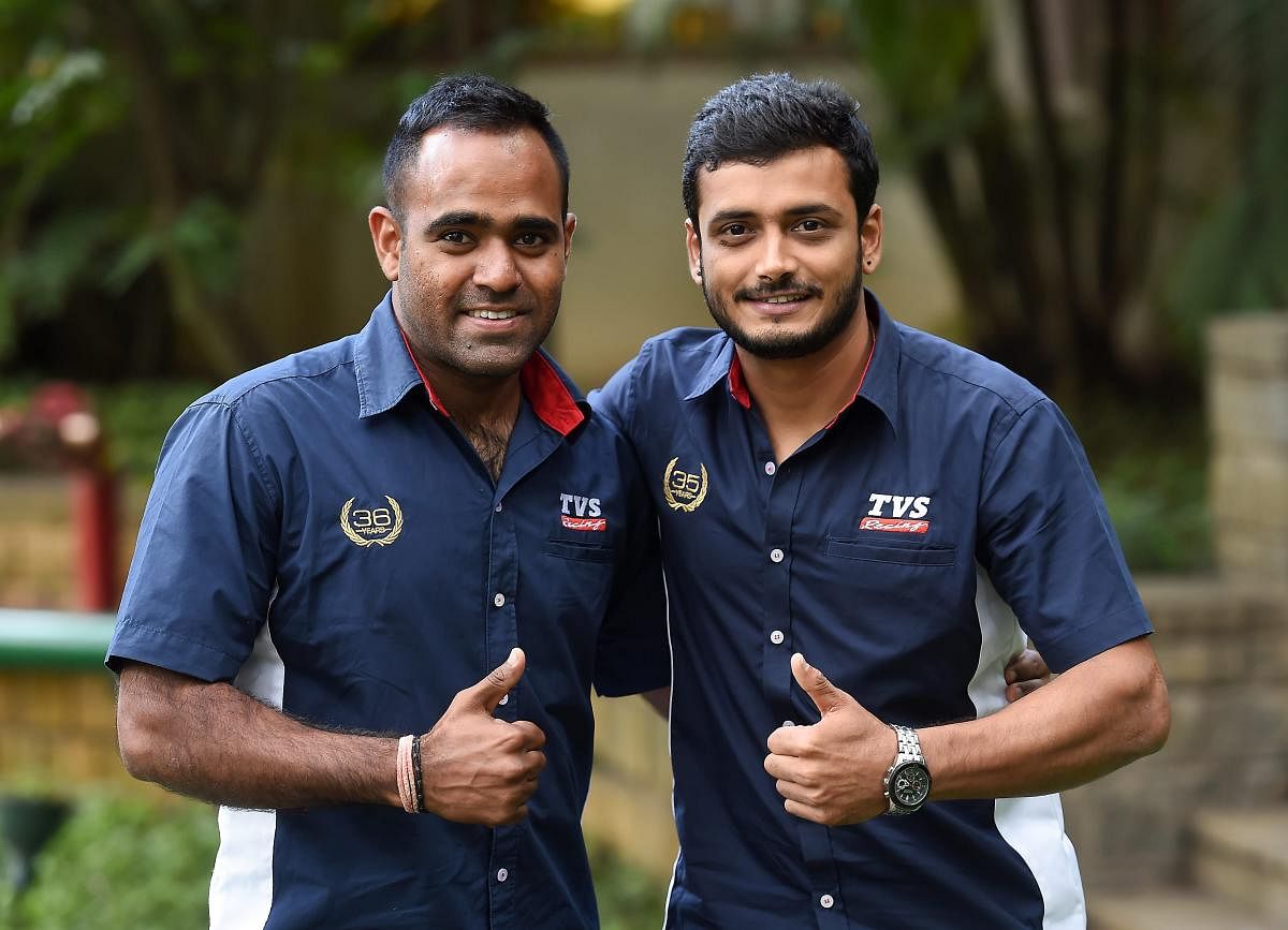 TVS racers Aravind K P (R) and Abdul Wahid Tanveer pose during a press conference regarding their participation in upcoming Pan Africa Moto rally 2018 in Morocco, in Bengaluru on Thursday, Aug 30, 2018. PTI