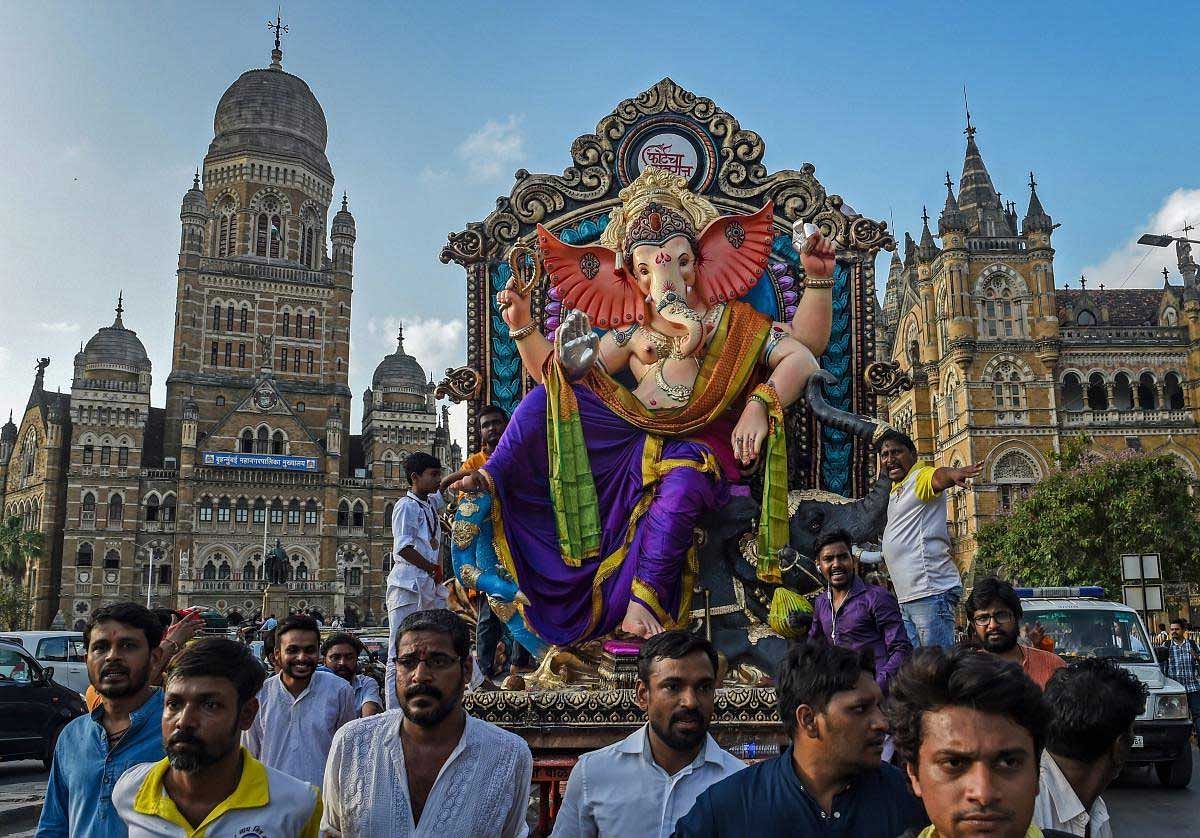  Devotees carry a Ganesha idol to be installed at a pandal ahead of Ganpati festival, in Mumbai, Saturday, Sept 8, 2018. PTI Photo