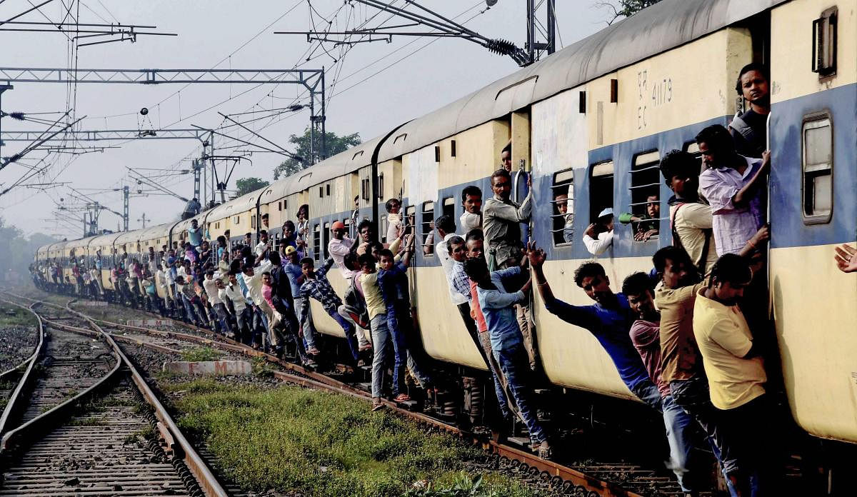 People travel by an over crowded train during the opposition parties' 'Bharat Bandh', called against the fuel price hike and devaluation of the rupee, in Patna, Monday, September 10, 2018. (PTI Photo) 
