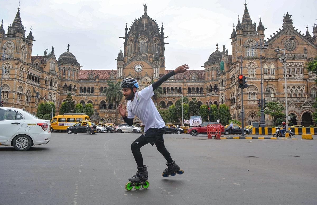 Skater Rana Uppalapati, a 37-year-old businessman from Visakhapatnam who is on a 6,000 km skating trip to educate girls, skates in the backdrop of Chhatrapati Shivaji Maharaj Terminus in Mumbai, Wednesday, Sep 19, 2018. (PTI Photo)