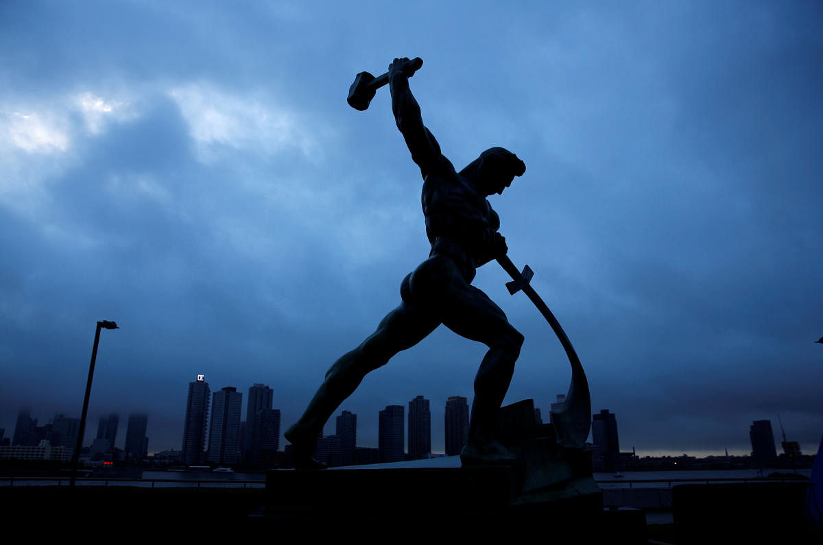 Dark clouds are seen behind the "Let us Beat Our Swords into Ploughshares" statue, by Soviet artist Evgeny Vuchetich, outside United Nations headquarters while global heads of state address the 73rd session of the United Nations General Assembly at U.N. headquarters in New York, U.S., September 26, 2018. REUTERS/Eduardo Munoz