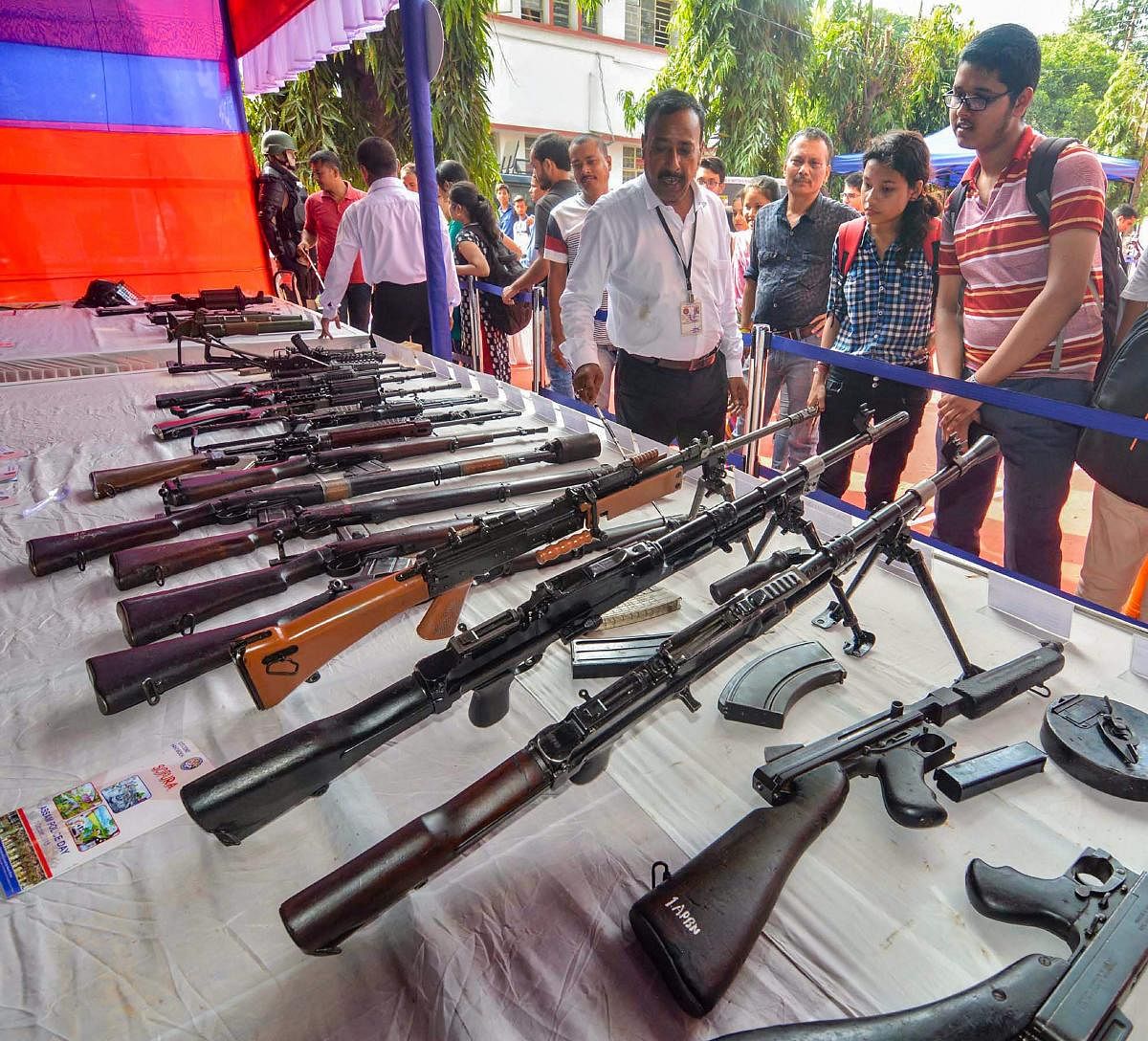 Students visit an arms stall during an exhibition to commemorate Assam Police Day, in Guwahati, Friday, Sept 28, 2018. (PTI Photo)