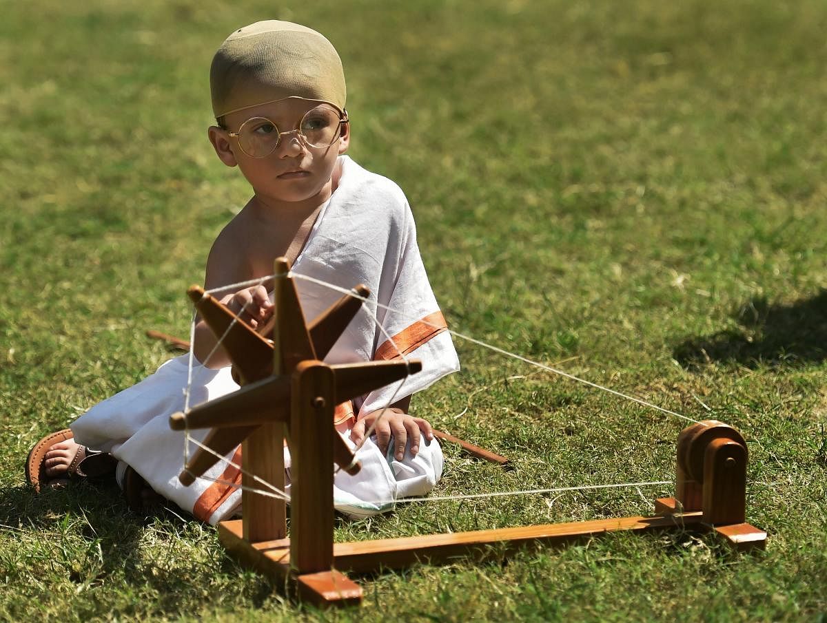 A student of a pre-school, dressed up as Mahatma Gandhi, participates in a function organised by Gujarat Vidyapith to celebrate 'Gandhi Jayanti', in Ahmedabad, Monday, October 1, 2018. (PTI Photo)