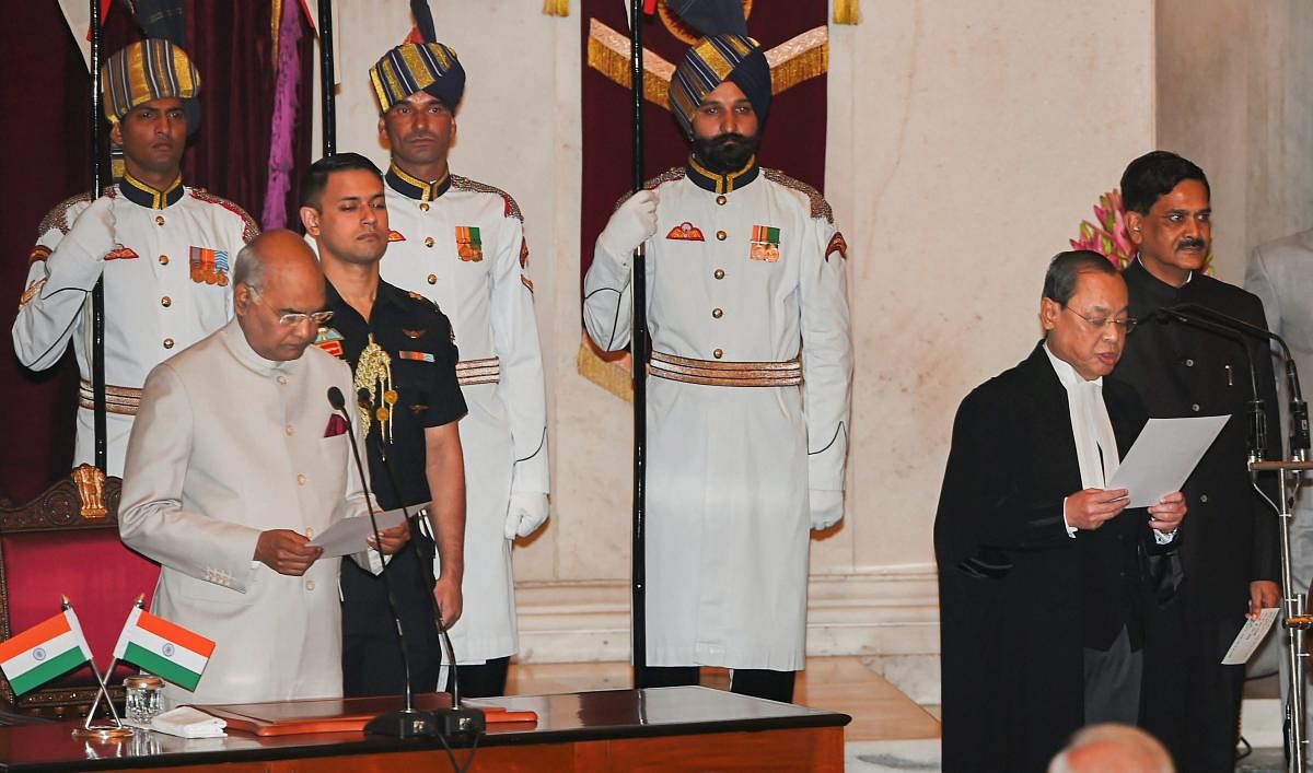 President Ram Nath Kovind administers oath of office to Justice Ranjan Gogoi after he was appointed as the 46th Chief Justice of India, at Rashtrapati Bhawan in New Delhi, Wednesday, Oct 3, 2018. (PTI Photo)