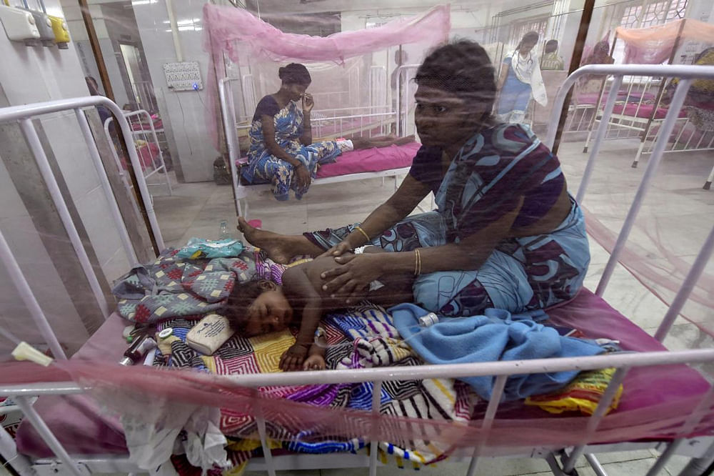 Dengue-affected children receive treatments in a special ward where beds are covered with mosquito-nets, at the Institute of Child Health and Hospital (ICHH) at Egmore, Chennai, Monday. 7-year-old twins Diksha and Dakshan died of dengue fever in the hospital. PTI Photo 