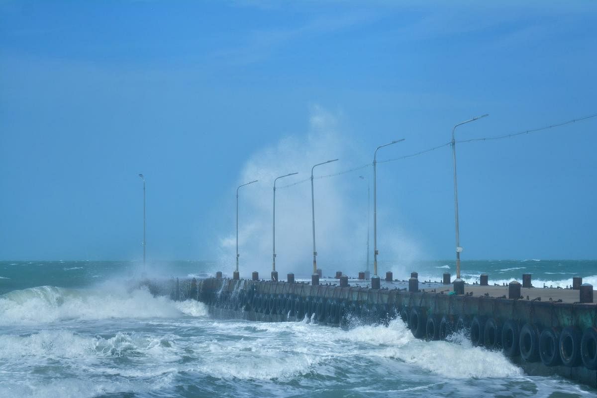 A wave hits the sea walkway after cyclonic storm 'Gaja' made landfall at Rameswaram, in Ramanathapuram district. PTI photo