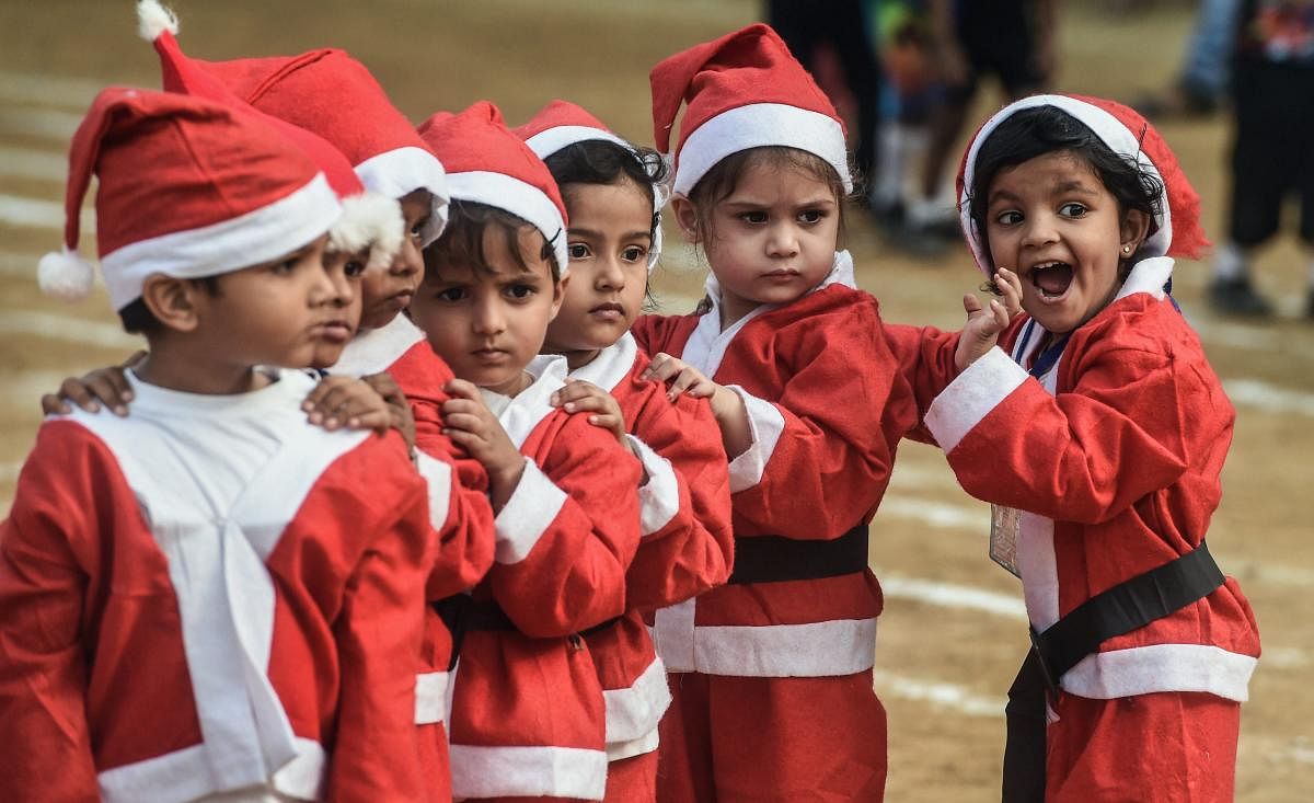 School children dressed as Santa Claus take part in school sports function in Mumbai on Saturday. PTI photo
