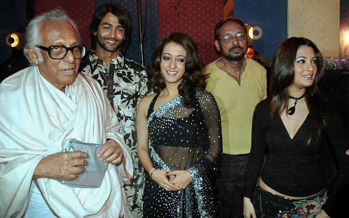 In this Jan 27, 2006 file photo noted film-maker Mrinal Sen is seen with actors Raima and Ria Sen during the premiere of a film in Kolkata. Mrinal Sen, 95, died at his residence in Kolkata. PTI