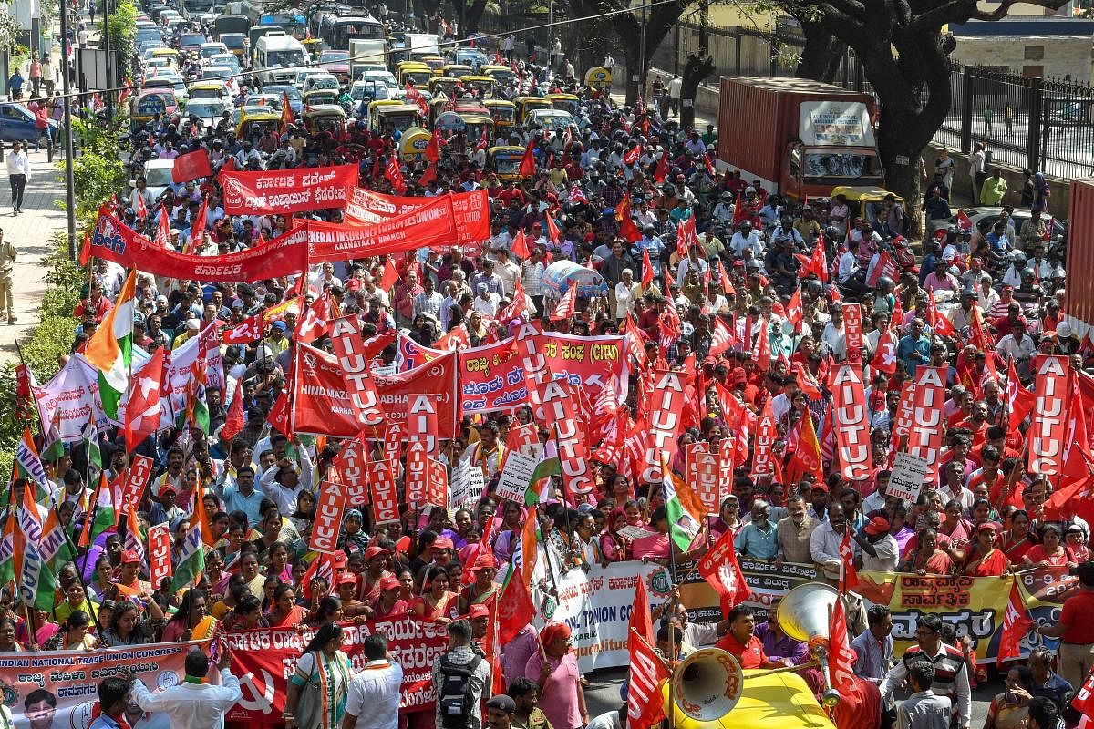 Factory workers and members of Centre of Indian Trade Unions (CITU) raise slogans during a 48-hour-long nationwide general strike called by central trade unions in protest against the "anti-people" policies of the Centre, in Bengaluru, Tuesday. (PTI Photo)