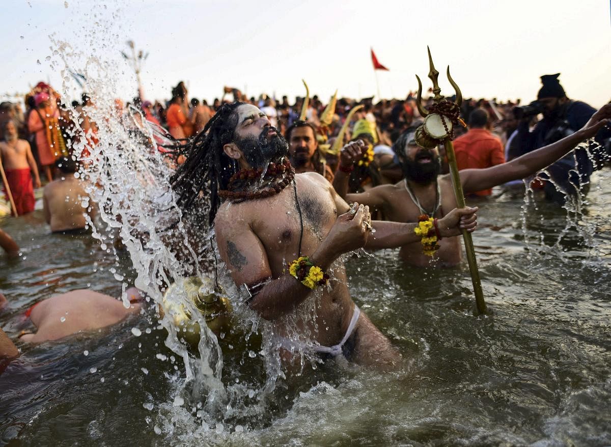  A Sadhu takes a holy dip in the water of River Narmada on the occasion of Makar Sankranti Festival in Jabalpur. PTI photo