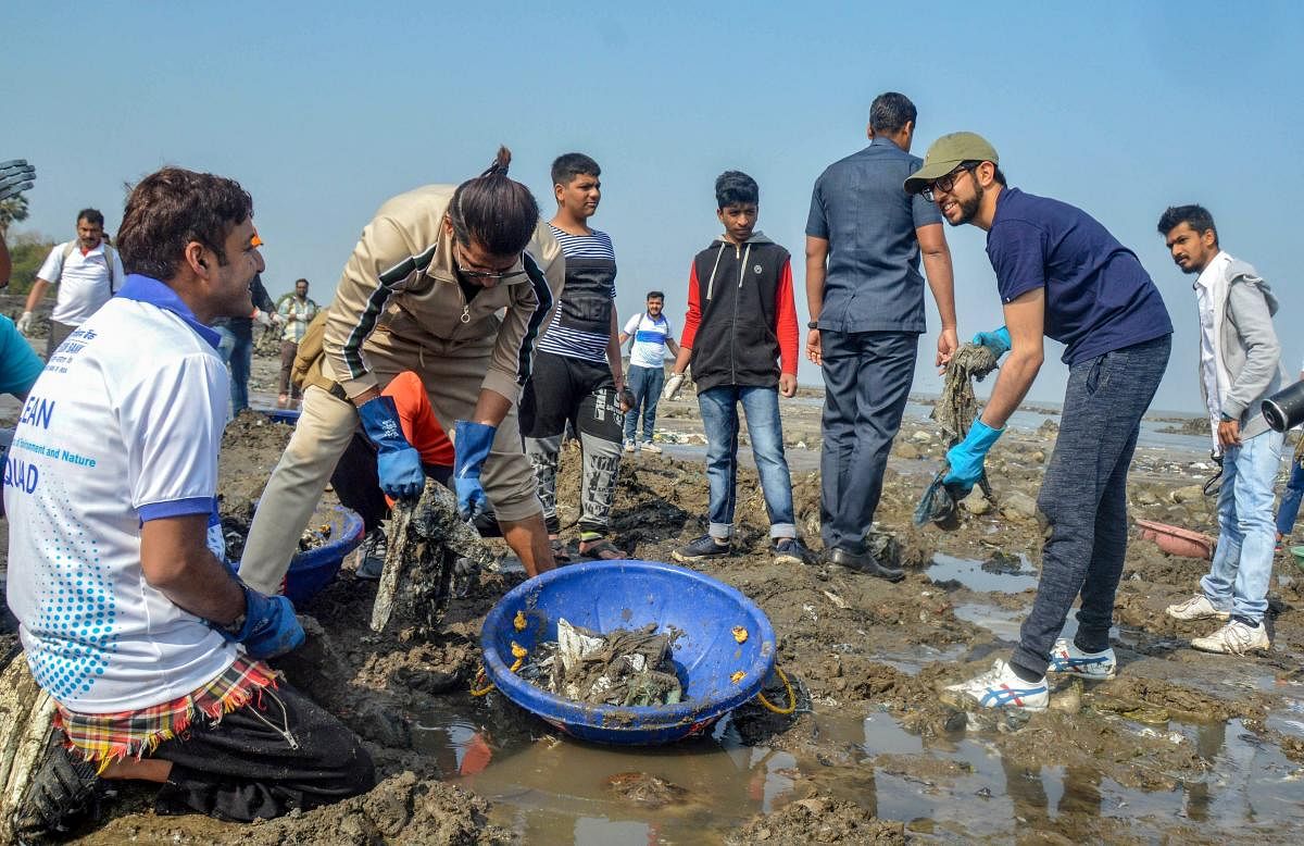 Lawyer Afroz Shah, the UN Champion of Earth 2016, with EXIM Bank Managing Director David Rasquinha and Yuva Sena President Aditya Thackeray during a beach clean-up drive at Malad West, in Mumbai, Saturday, Jan 26, 2019. (PTI Photo)