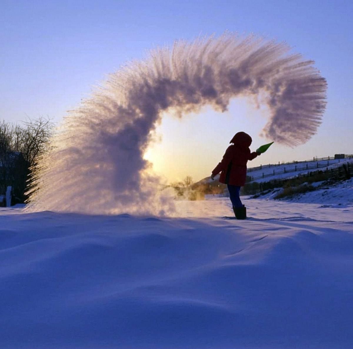  a woman throws boiling water into the freezing air as its instantly condenses into an elaborate pattern of ice crystals in Irkutsk, Russia . Residents of Russia's Urals and Siberia where temperatures recently plunged to minus 40 degrees Fahrenheit have taken to social media to celebrate the cold. Temperatures in Siberia and the Urals earlier this week plunged to around minus 40 degrees Centigrade (minus 40 degrees Fahrenheit) which is unusually low even for the cold-resistant Russians. AP/PTI