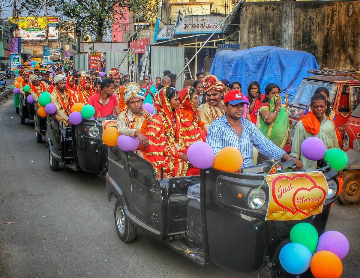 55 newly wedded couples ride autorickshaws in a procession after a mass marriage ceremony, in Angul, Odisha, Sunday, Feb 10, 2019. (PTI Photo)