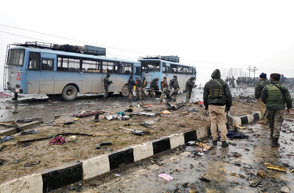 Indian soldiers examine the debris after an explosion in Lethpora in south Kashmir's Pulwama district February 14, 2019. REUTERS