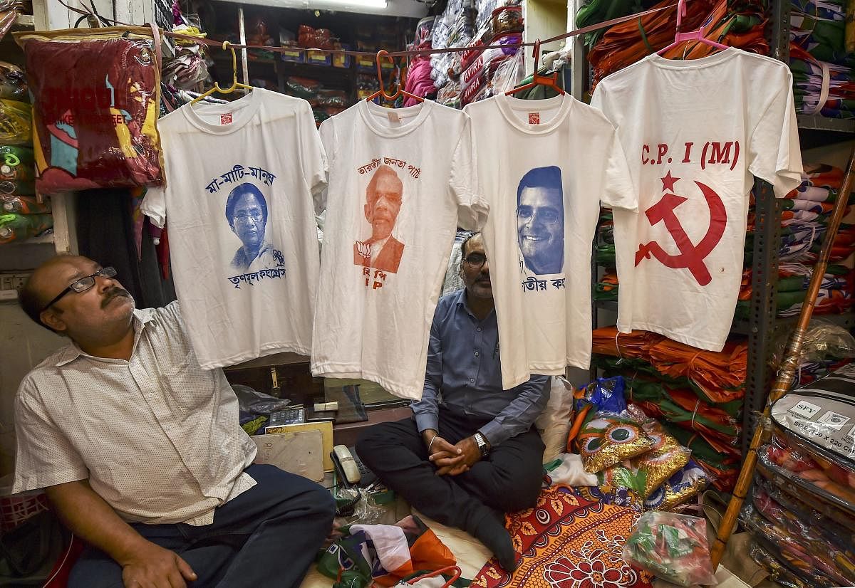 A shopkeeper displays T-shirts with portraits of politicians printed on them, ahead of the Lok Sabha polls, in Kolkata, Thursday, March 14, 2019. (PTI Photo/Swapan Mahapatra)
