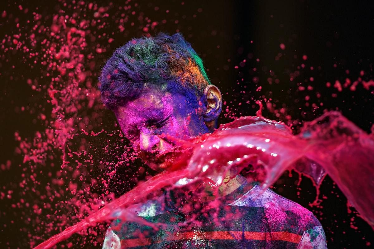 People splash colour water at each other during 'Holi' celebrations in Chennai. (PTI Photo)
