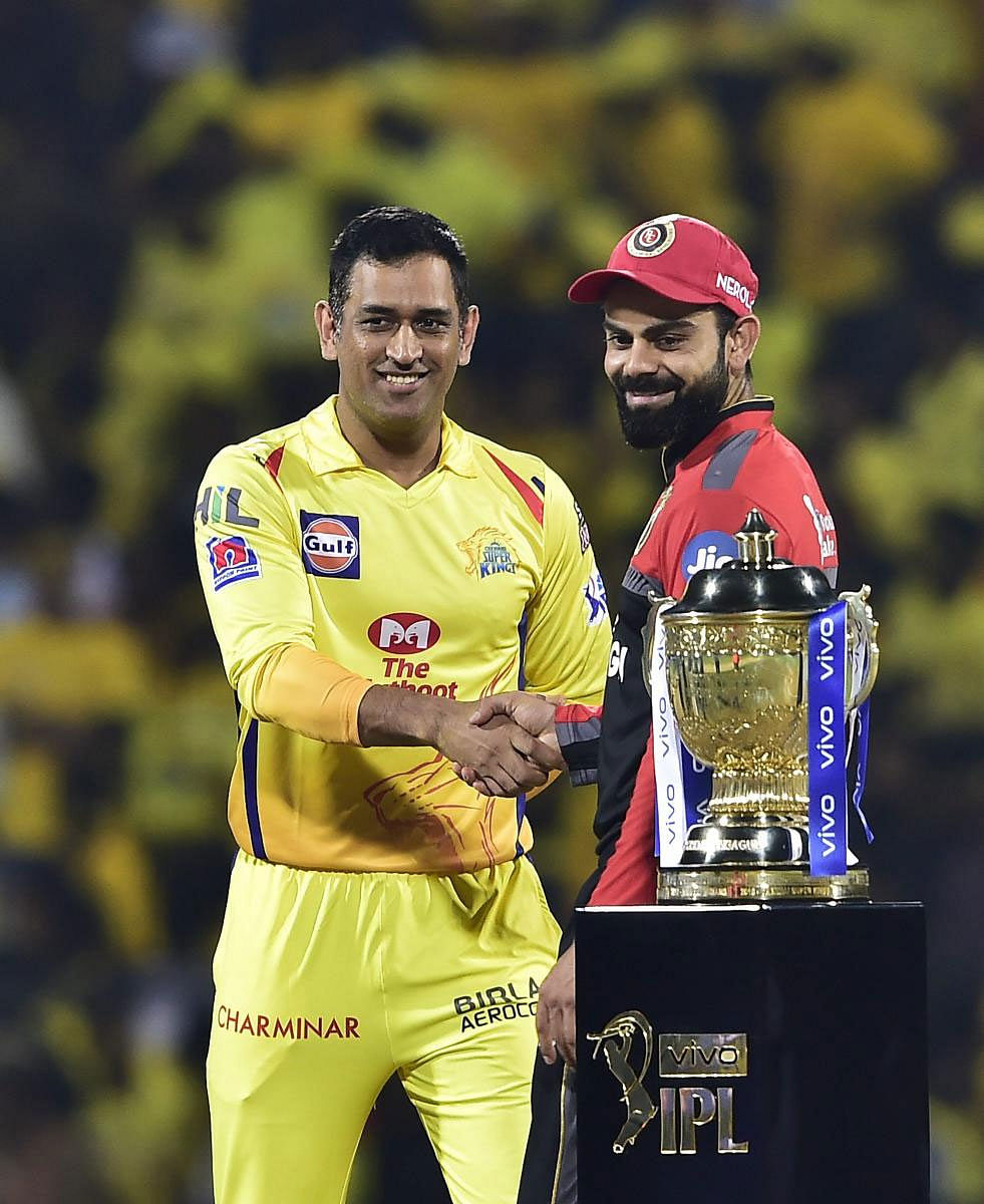  Skipper MS Dhoni of Chennai Super Kings and Skipper Virat Kohli of Royal Challengers Bangalore during the first match of 12th edition of the Indian Premier League 2019 T20 cricket tournament between Chennai Super Kings and Royal Challengers Bangalore at MAC Stadium in Chennai, Saturday, March 23, 2019. (PTI Photo)