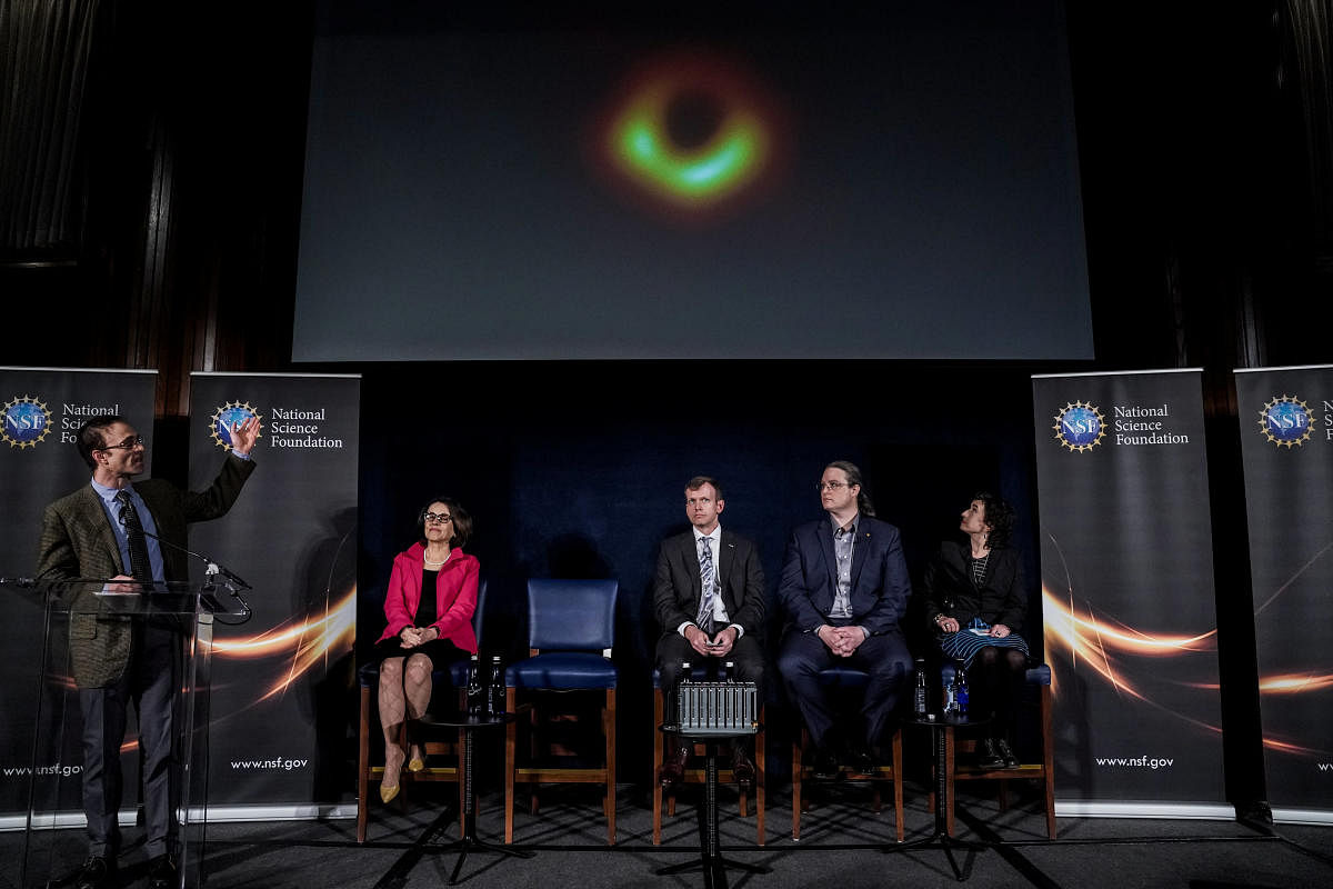 Shepherd Doeleman shows the first image of a black hole during the press conference in Washington, U.S., April 10, 2019. REUTERS