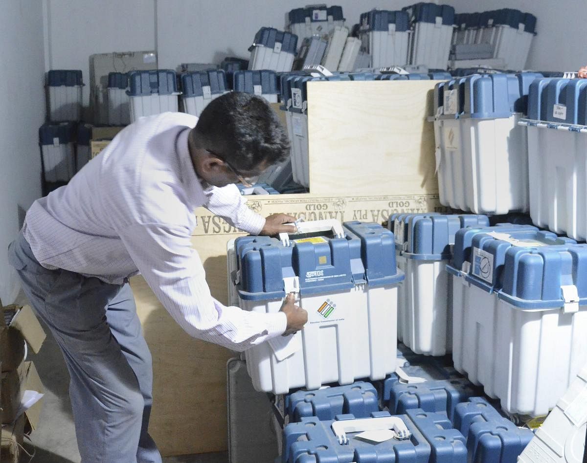 Dibrugarh: A polling officer counts the EVMs (Electronic Voting Machines) kept in a strong room after the first phase of general elections, in Dibrugarh, Friday, April 12, 2019. PTI