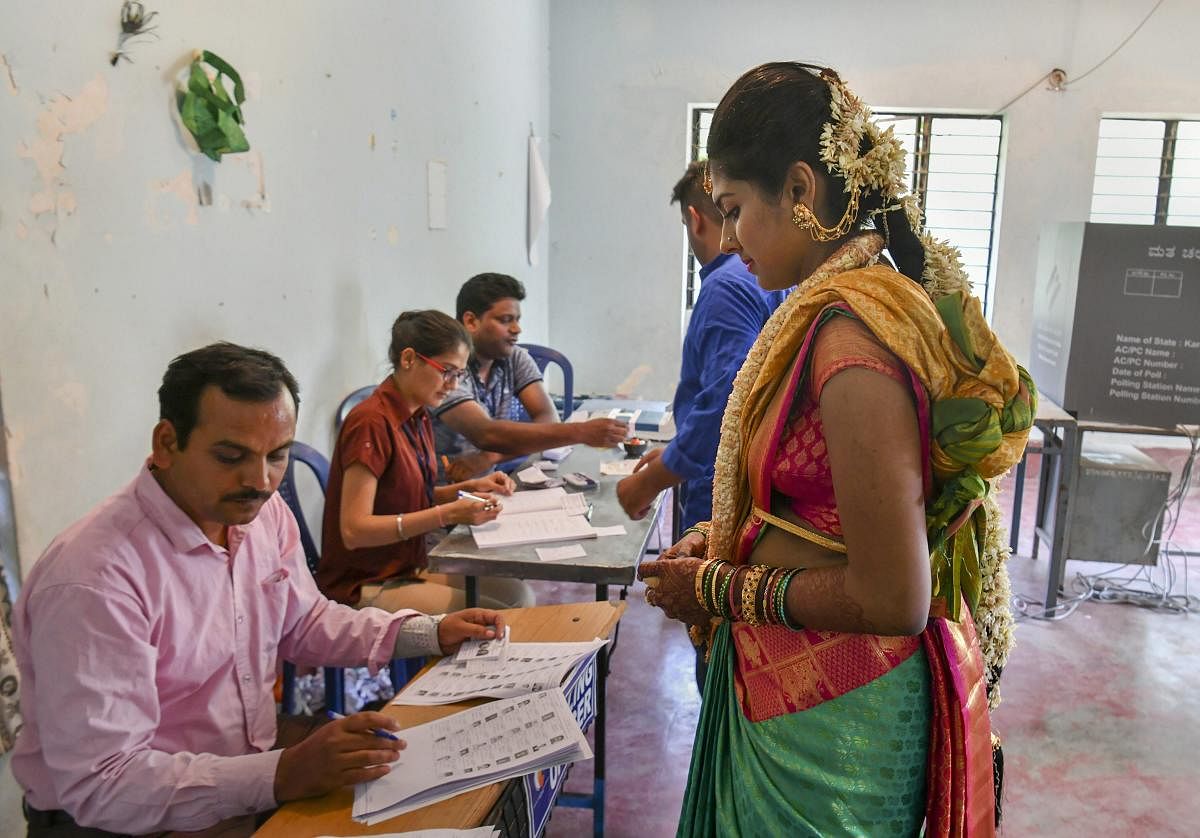 Bengaluru: A bride arrives to cast her vote at a polling station, during the 2nd phase of Lok Sabha elections in Bengaluru, Thursday, April 18, 2019. PTI