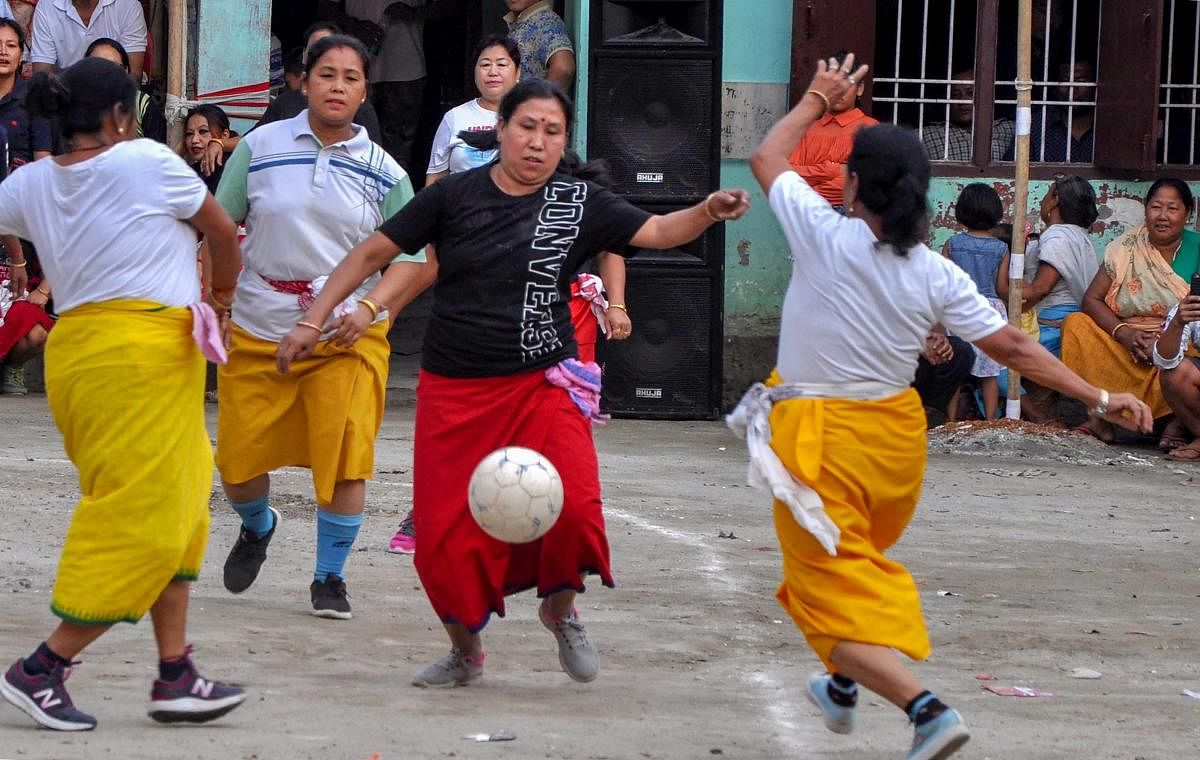 Guwahati: Manipuri women, in their traditional dresses, play football while celebrating their New Year day festival 'Cheiraoba' in Guwahati, Friday, April 19, 2019