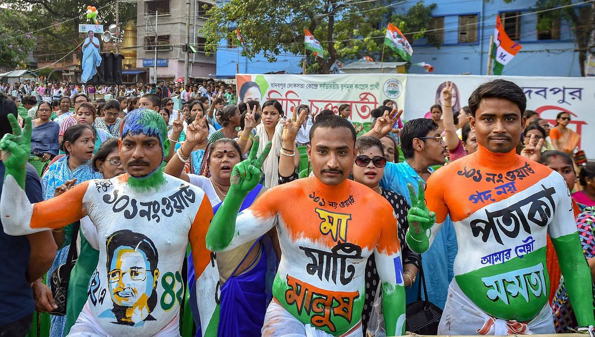 Trinamool Congress supporters during West Bengal Chief Minister and TMC supremo Mamata Banerjee's election rally for Lok Sabha polls, in Kolkata, Tuesday, May 14, 2019. (PTI Photo)