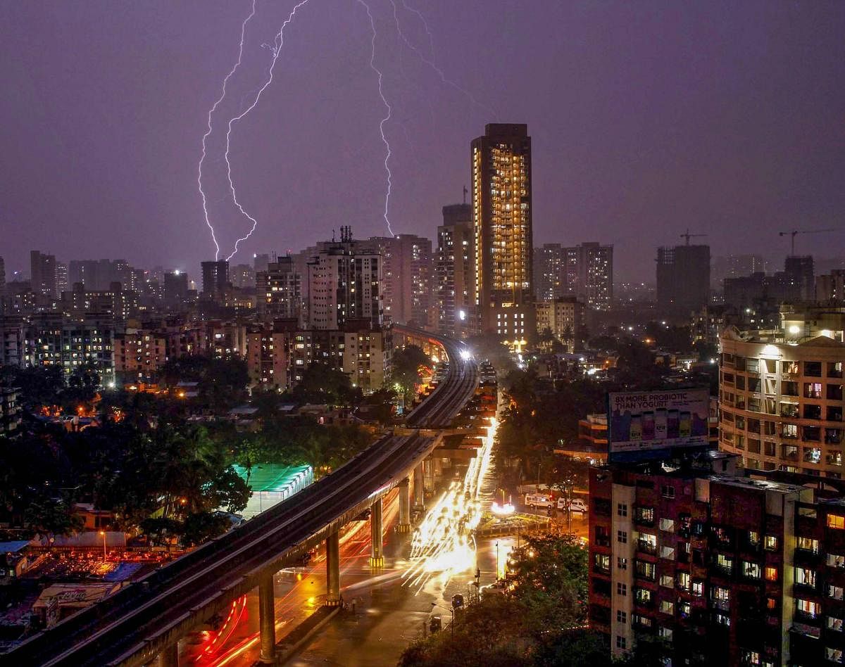 Bolts of lightning flash across the sky during thunderstorm and rain over the suburbs, in Mumbai, late Monday, June 10, 2019. (PTI Photo/Neel Geelani)